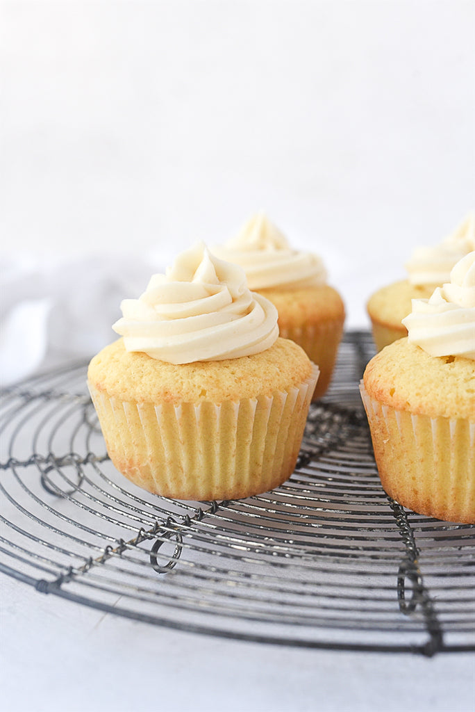 This small batch yellow cupcake recipe makes four soft, tender, and delicious cupcakes topped with creamy buttercream frosting