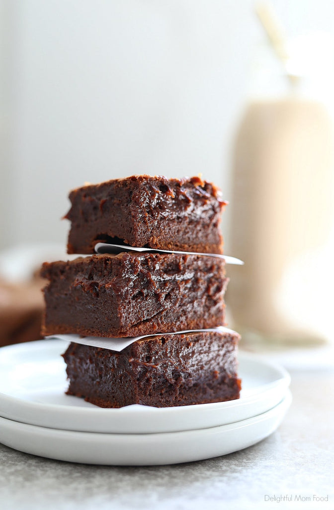 Extra fudgy coconut oil brownies! This is by far the BEST gluten-free brownie recipe with a rich chocolate center that melts in your mouth! These easy chocolate brownies take little time to whip up and are a crowd-pleaser every time!